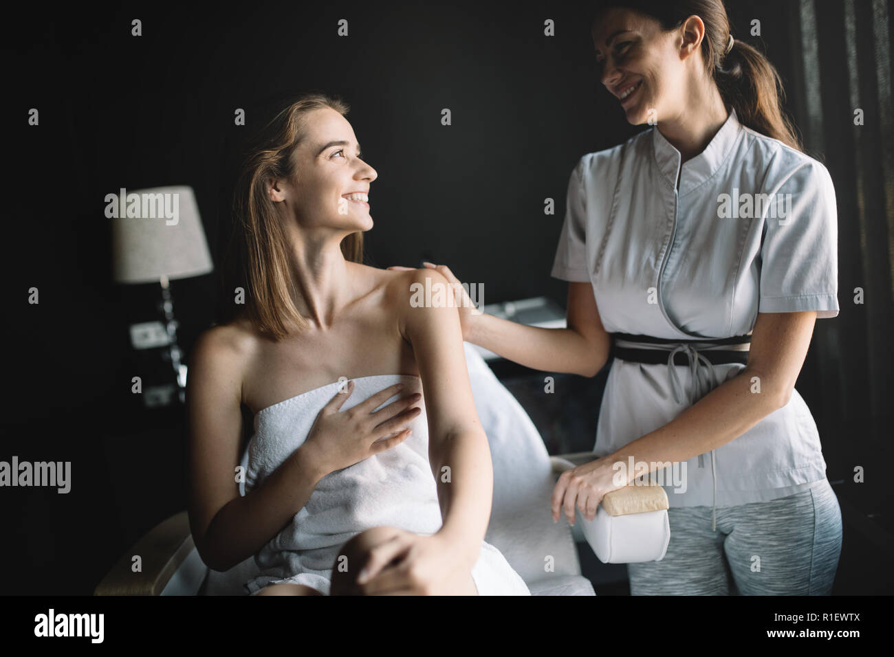 Woman enjoying skin and face treatment and massage Stock Photo
