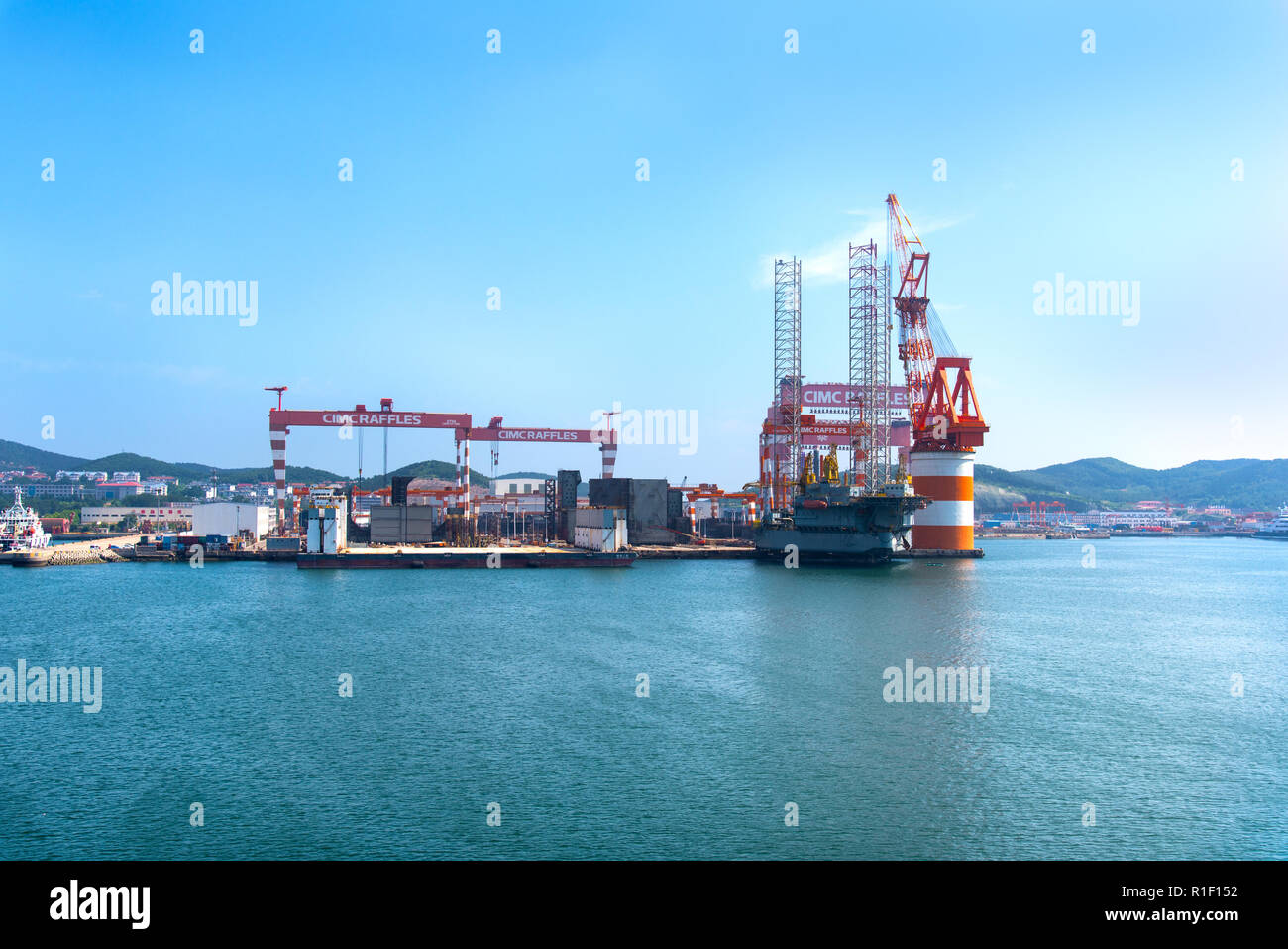 YANTAI, SHANDONG, CHINA - 21JUL2018: The CIMC Raffles Shipyard. The complex includes one of the largest dry docks in the world. Stock Photo