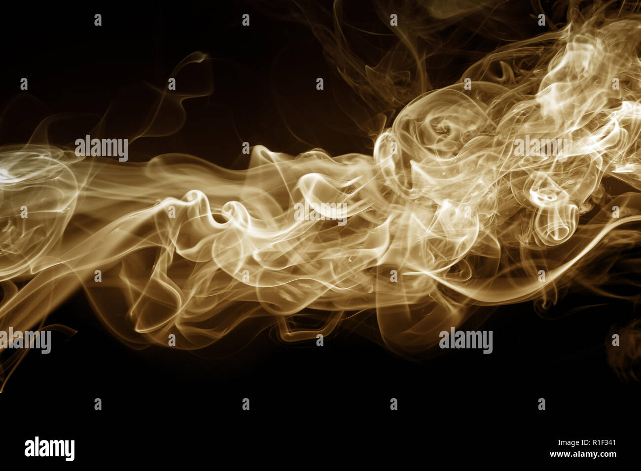 yellow smoke abstract on black background, fire design Stock Photo