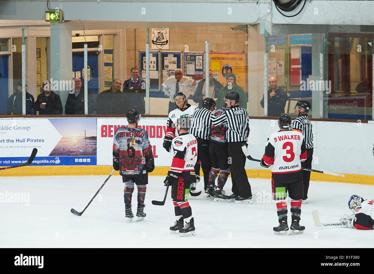 Referees breaking up a fight in an ice hockey match Stock Photo Alamy