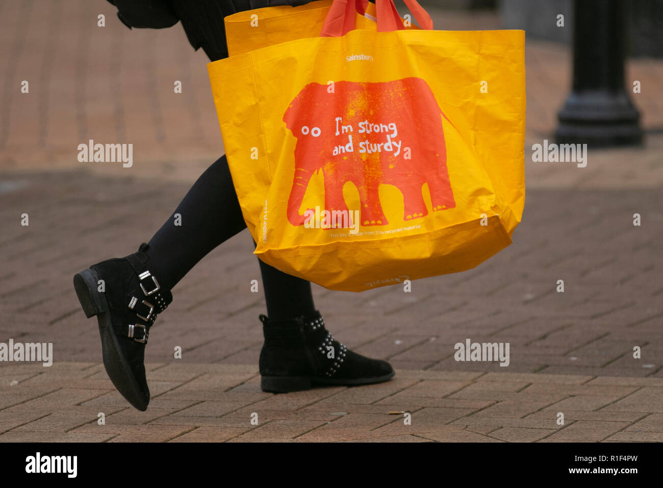 Saiinsburys Strong & Sturdy yellow reusable, recycle, recycling, reusable, shopping, consumerism, convenience, supermarket, plastic shopping, carrying bags, reusable bag for life, store bags for life supermarket 100% recycled plastic Carrier Bags for Life, Preston, UK Stock Photo