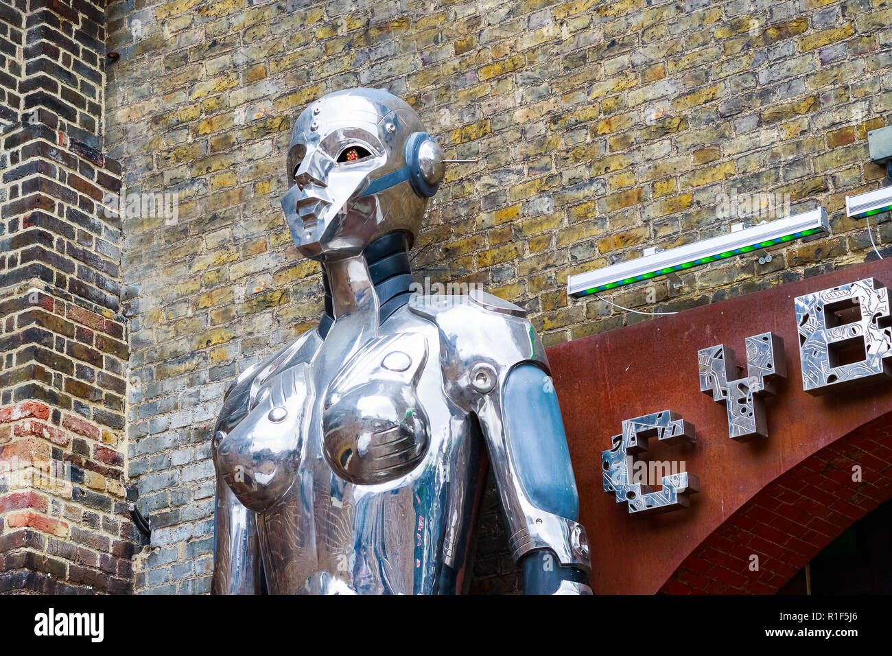 London, UK - September 1, 2018 - Giant robot statue flanking outside Cyberdog known for futuristic and fluorescent clothing and fashion, Camden market Stock Photo