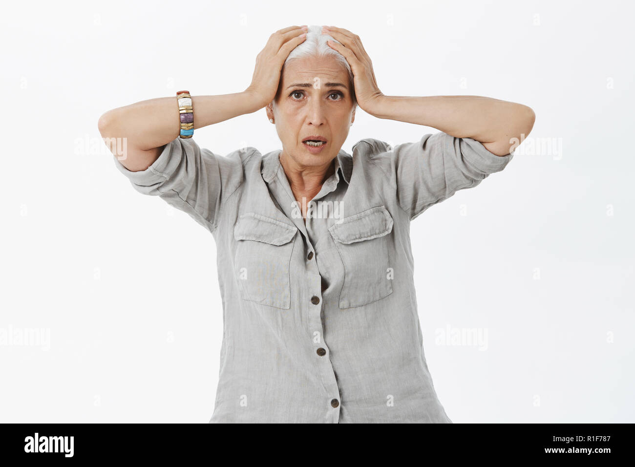 Woman too old for such nerves. Portrait of concerned and confused ...