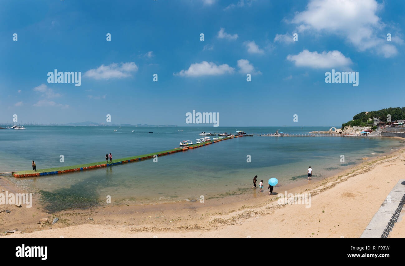 YANTAI, SHANDONG, CHINA - 16JUL2018: Moon Bay is a popular beach in Yantai. Stock Photo
