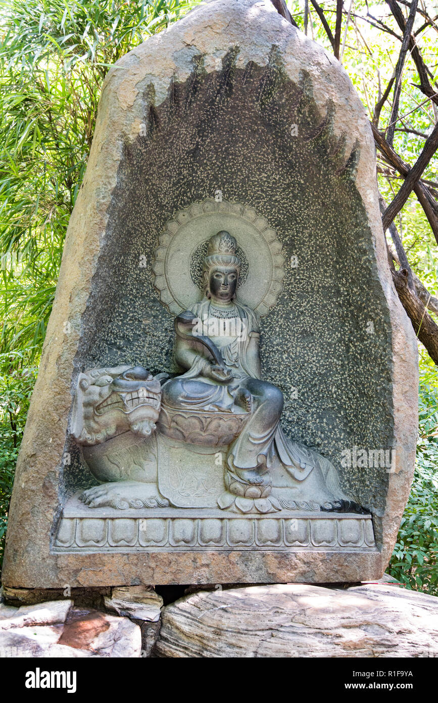 XIAN, CHINA - 27JUL2018: Budda figure at the Daci'en Temple complex surrounding the Great Wild Goose Pagoda Stock Photo