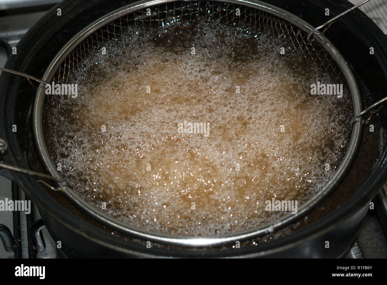 fryer filled with boiling oil Stock Photo Alamy