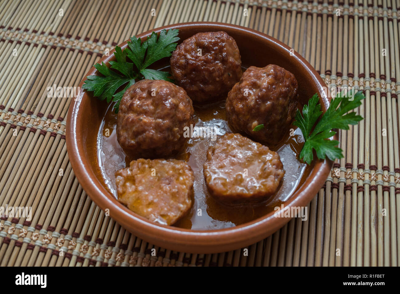 Meatballs of pork and beef with sauce and parsley on a plate Stock Photo