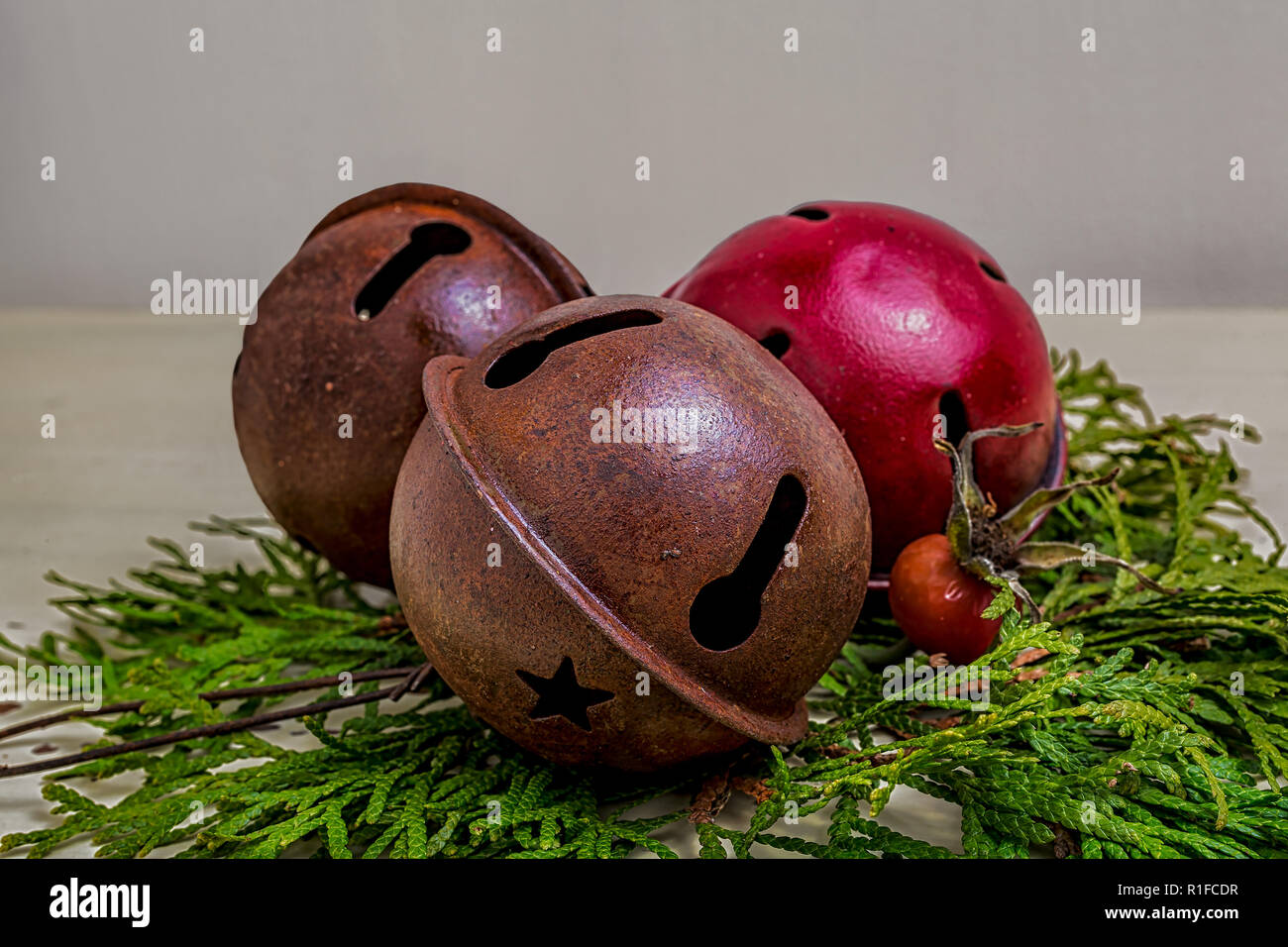 Old fashioned bells with cedar branches and rose hips Stock Photo Alamy