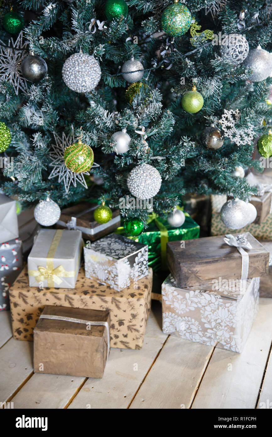 Christmas gifts under the Christmas tree with decorations in the