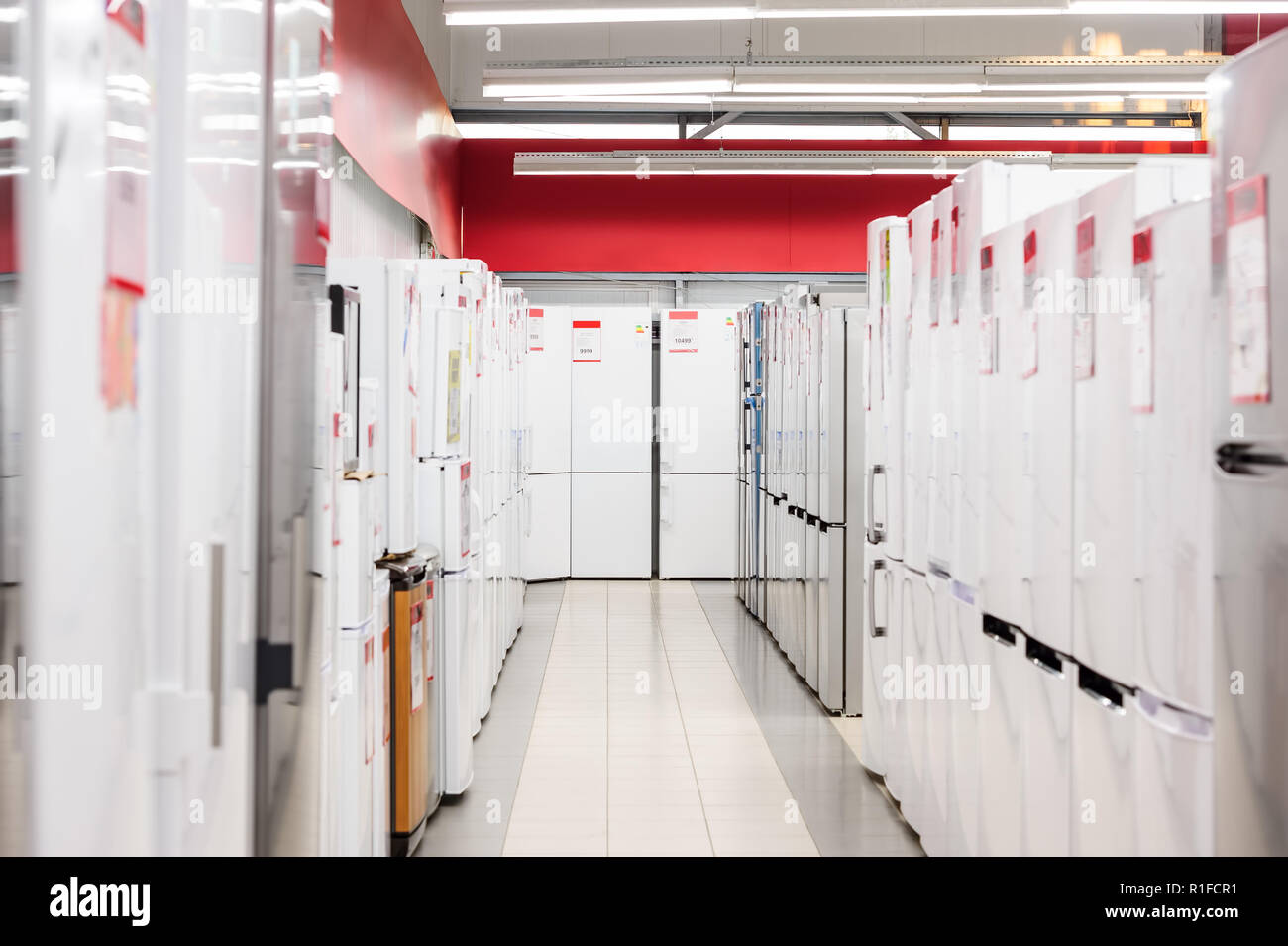 rows of refrigerators in appliance store Stock Photo