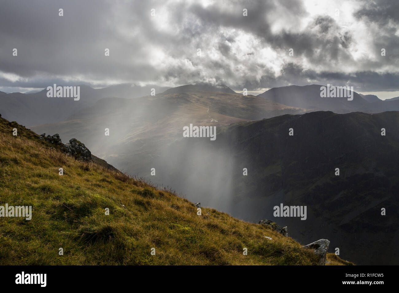 Shafts of Light Illuminate Honister and the Fells of Grey Knotts and Brandreth, Viewed from Hindscarth Edge, Dale Head, Lake District, Cumbria, UK Stock Photo