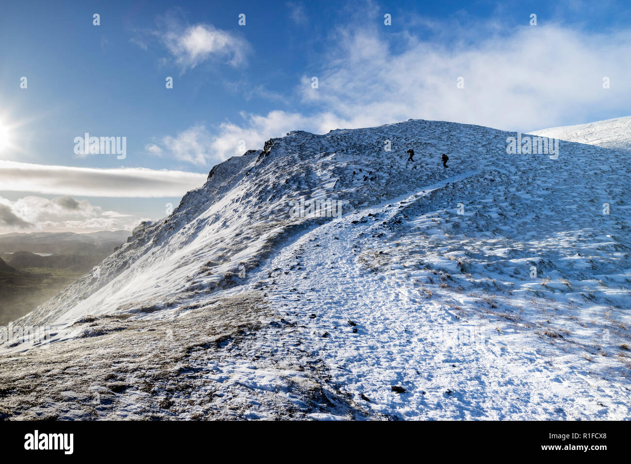 Walkers on Scales Fell Ridge, Blencathra, in Winter, Lake District, Cumbria, UK Stock Photo