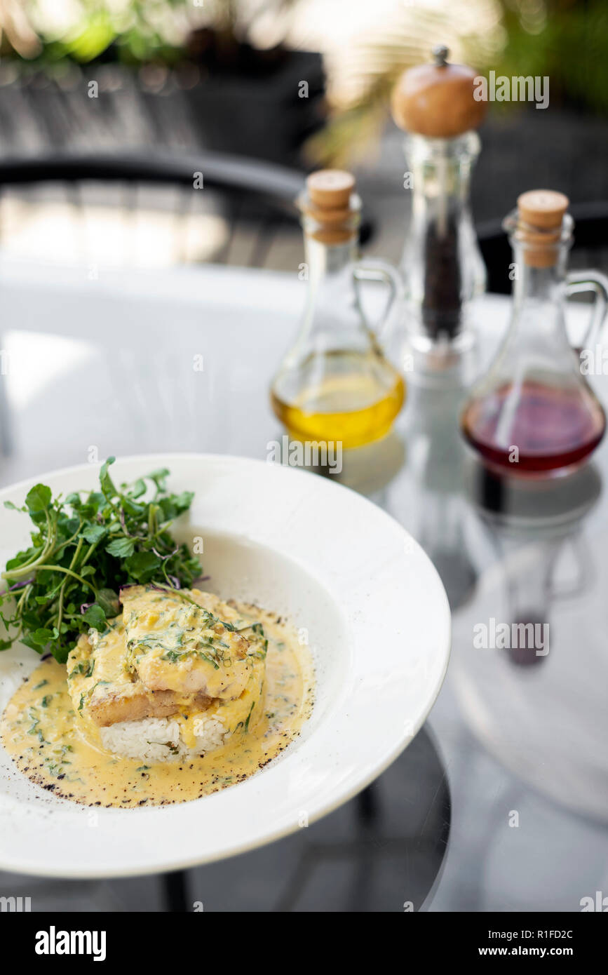 sea bream fish fillet in creamy mustard dill and lemon sauce restaurant meal on plate Stock Photo