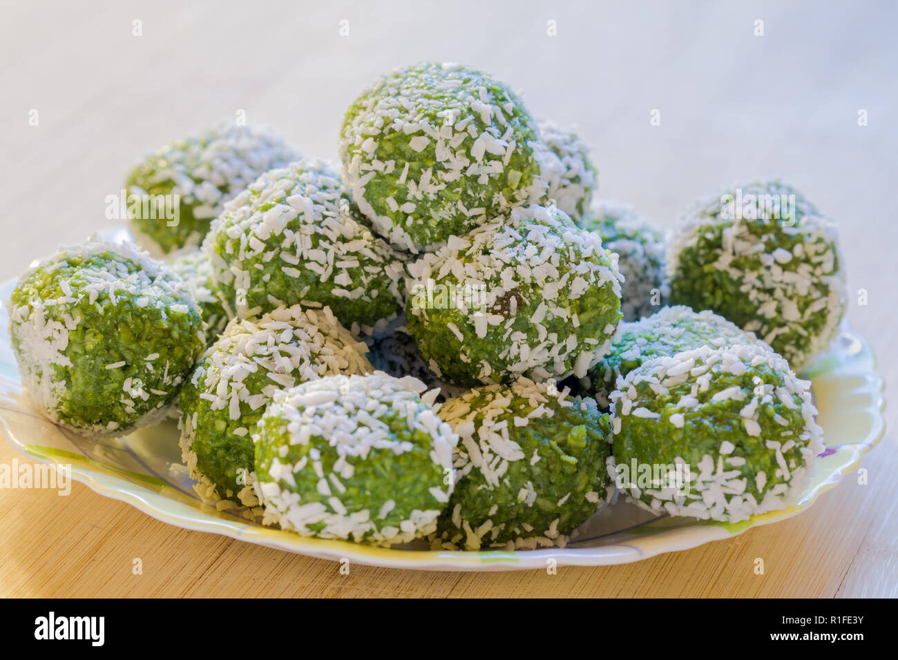 Delicious Indian Dessert (Laddoos) Made Of Betel Leaves (Paan) and Coconut Stacked On Top of Each Other Stock Photo