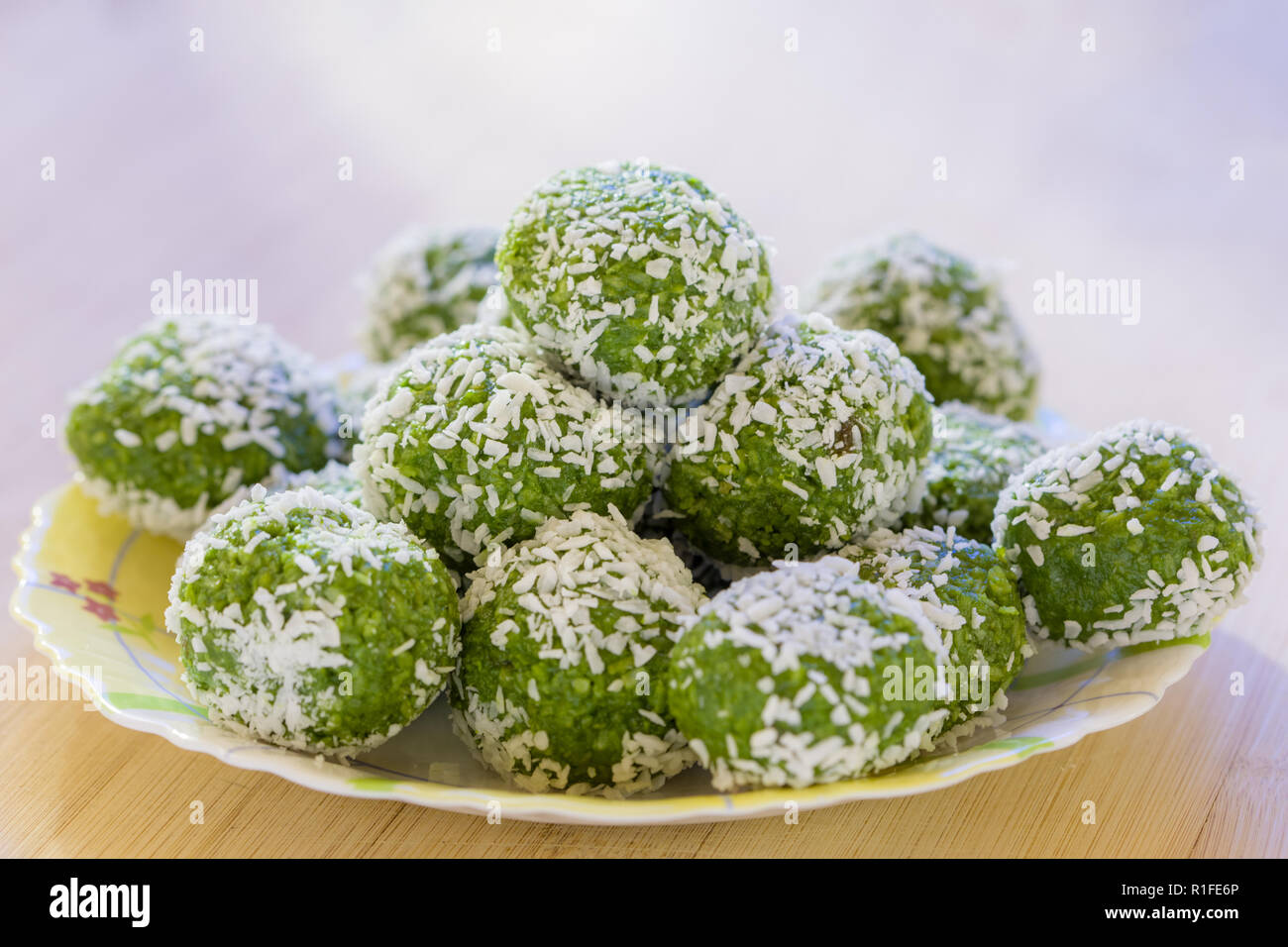 Delicious Indian Dessert (Laddoos) Made Of Betel Leaves (Paan) and Coconut Stacked On Top of Each Other Stock Photo