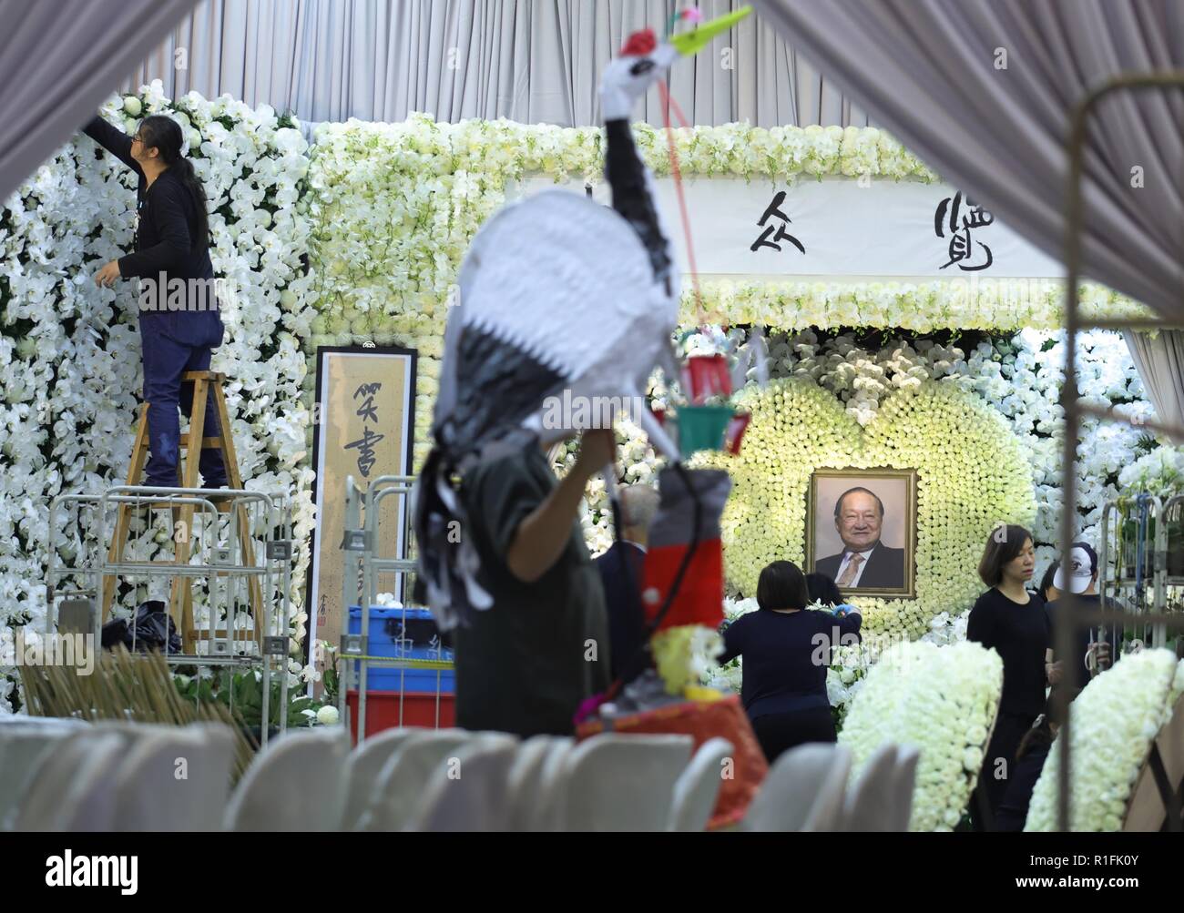 Hong Kong. 12th Nov, 2018. Staff at the funeral house passing through a