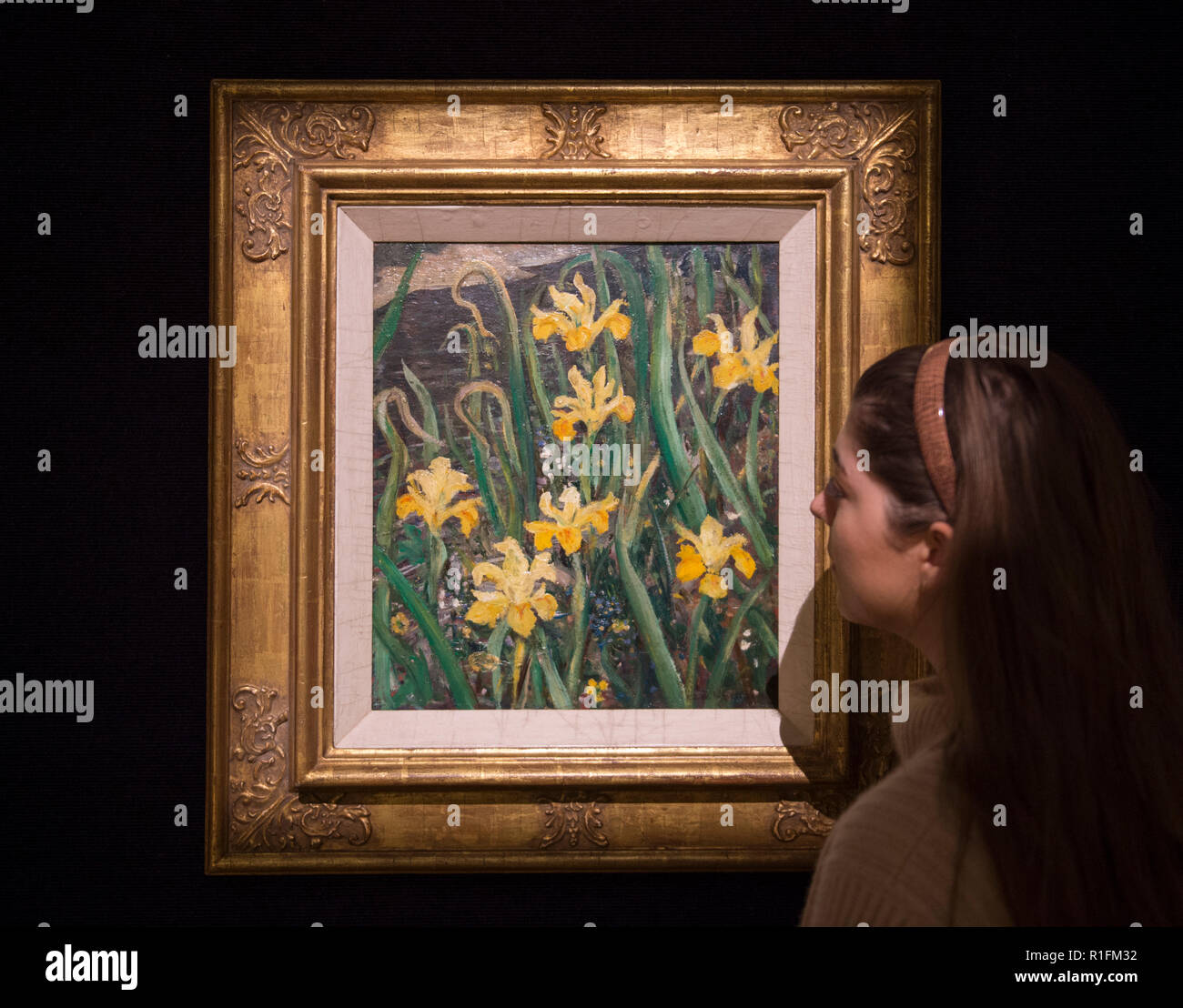 Bonhams, New Bond Street, London, UK. 12 November, 2018. Mask, an extremely rare sculpture by Henry Moore, is being offered at Bonhams Modern British and Irish Art sale for the first time in more than 80 years, and has never before been put up for auction. Image: Christopher Richard Wynne Nevinson ARA, Marsh Iris, c.1935, estimate £8,000-12,000. Credit: Malcolm Park/Alamy Live News. Stock Photo