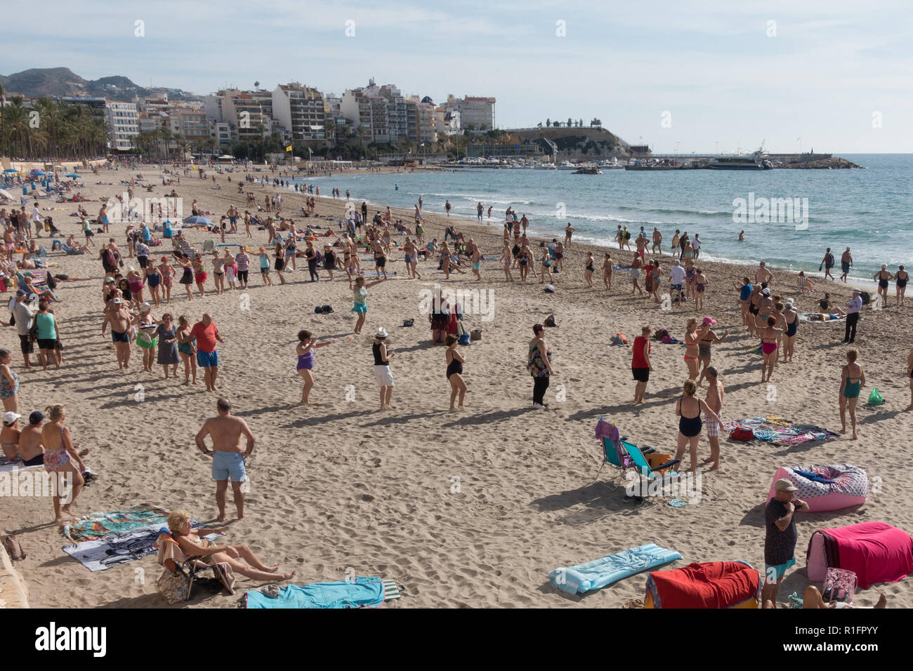 Benidorm, Costa Blanca, Spain 12th November 2018. Snow bird holiday makers  enjoy the winter sun in Spain with daytime temperatures in the mid 20's  Celsius bringing large crowds onto the beach where