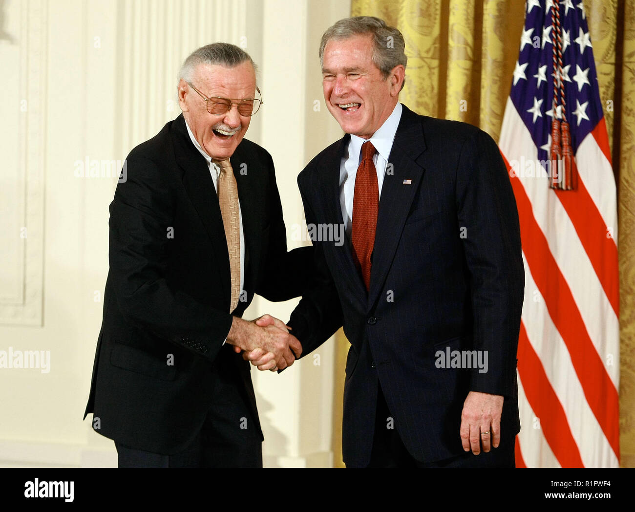Washington, DC. 17th Nov, 2008. Washington, DC - November 17, 2008 -- United States President George W. Bush congratulates Stan Lee, founder of POW! Entertainment before presenting him with the 2008 National Medals of Arts award during an event in the East Room at the White House on Monday, November17, 2008 in Washington, DC. During the event president Bush presented recipients with awards for the National Medals of Arts and the National Humanities Medal. Credit: Mark Wilson - Pool via CNP | usage worldwide Credit: dpa/Alamy Live News Stock Photo