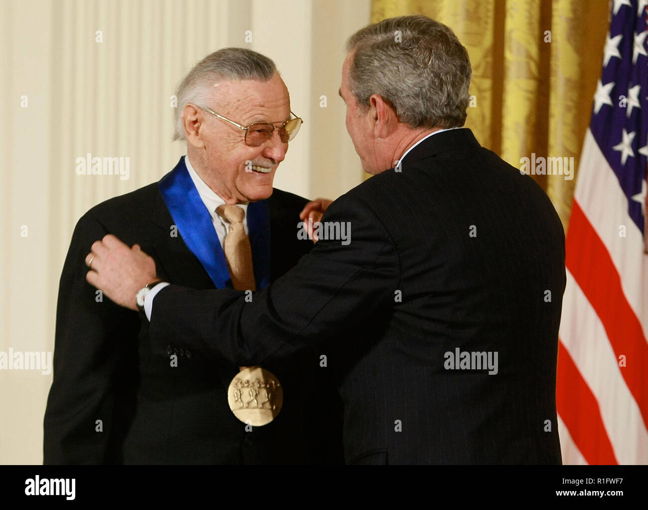 Washington, DC. 17th Nov, 2008. Washington, DC - November 17, 2008 -- United States President George W. Bush congratulates Stan Lee, founder of POW! Entertainment after presenting him with the 2008 National Medals of Arts award during an event in the East Room at the White House on Monday, November 17, 2008 in Washington, DC. During the event president Bush presented recipients with awards for the National Medals of Arts and the National Humanities Medal. Credit: Mark Wilson - Pool via CNP | usage worldwide Credit: dpa/Alamy Live News Stock Photo