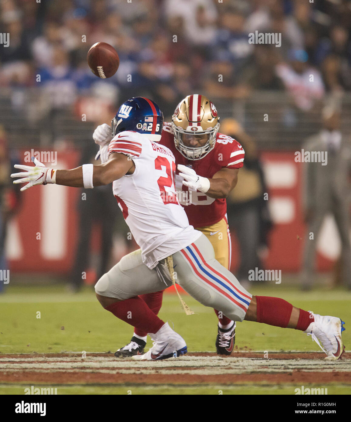 Santa Clara, CA, USA. 12th Nov, 2018. San Francisco 49ers middle linebacker Fred  Warner (48) knocks the ball loose from New York Giants running back Saquon  Barkley (26) in the second quarter