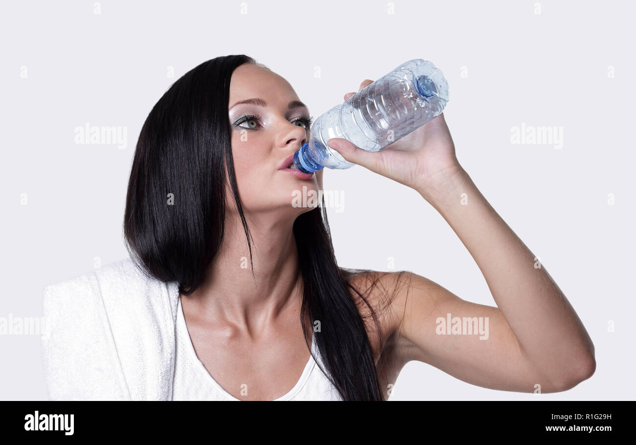 Sporting girl drinking water during exercise Stock Photo Alamy