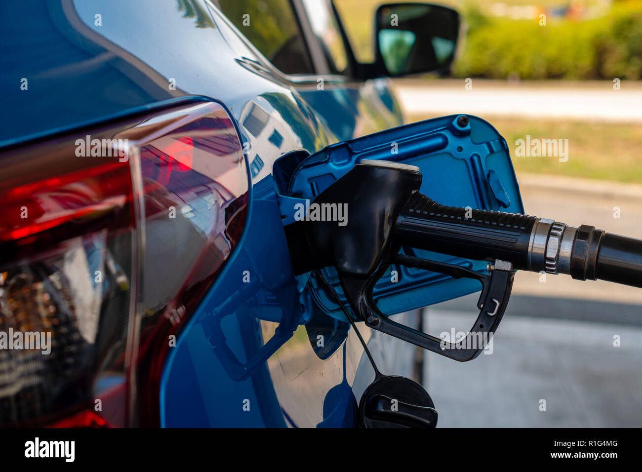 Refueiling Car Refueling car at the refuel station , car fuels concept Stock Photo - Alamy