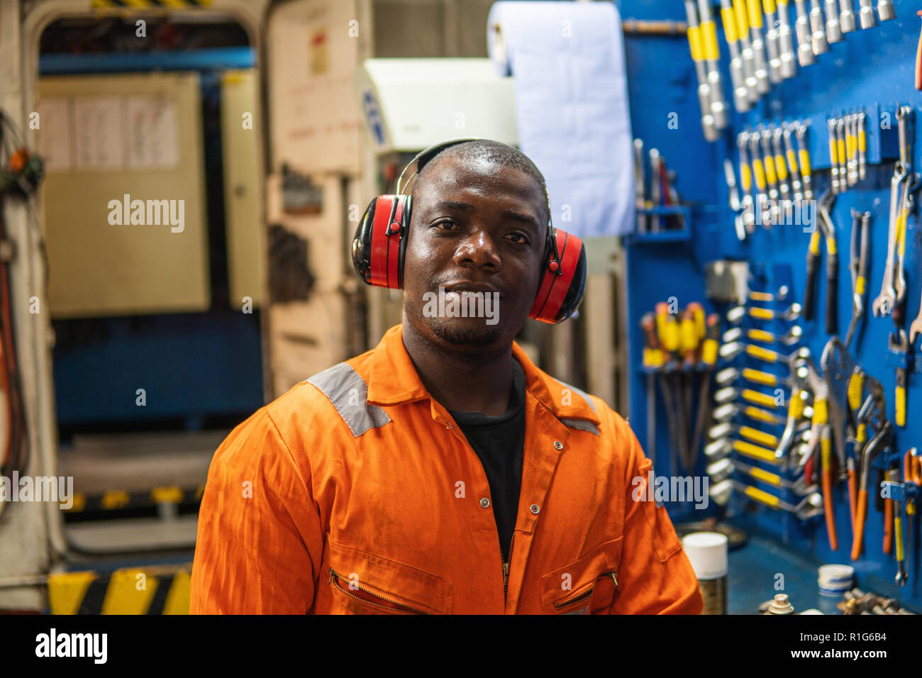 Marine engineer officer working in engine room Stock Photo Alamy