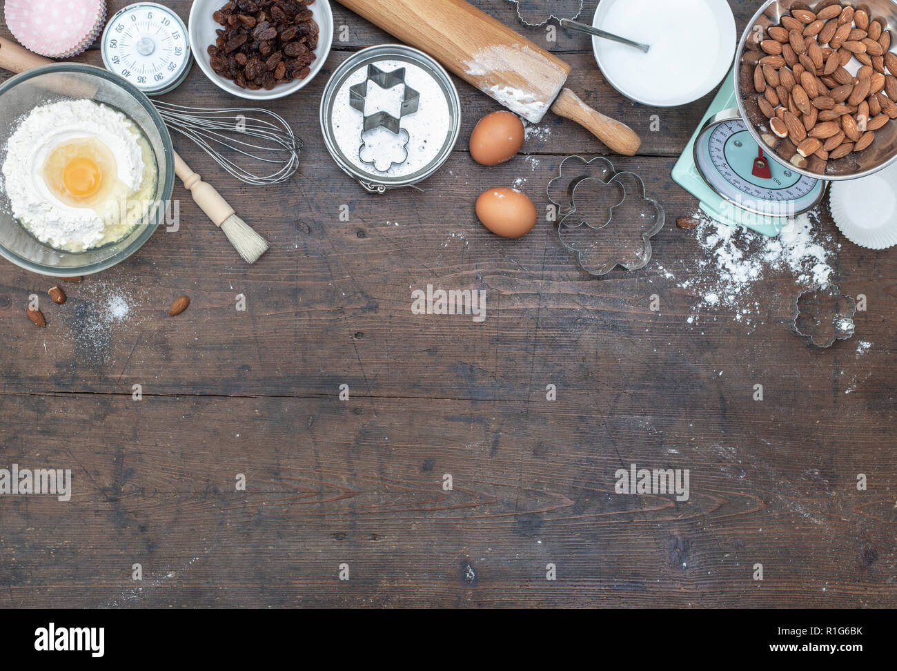 Home baking kitchen setting with ingredients for bread and cup cakes Stock Photo