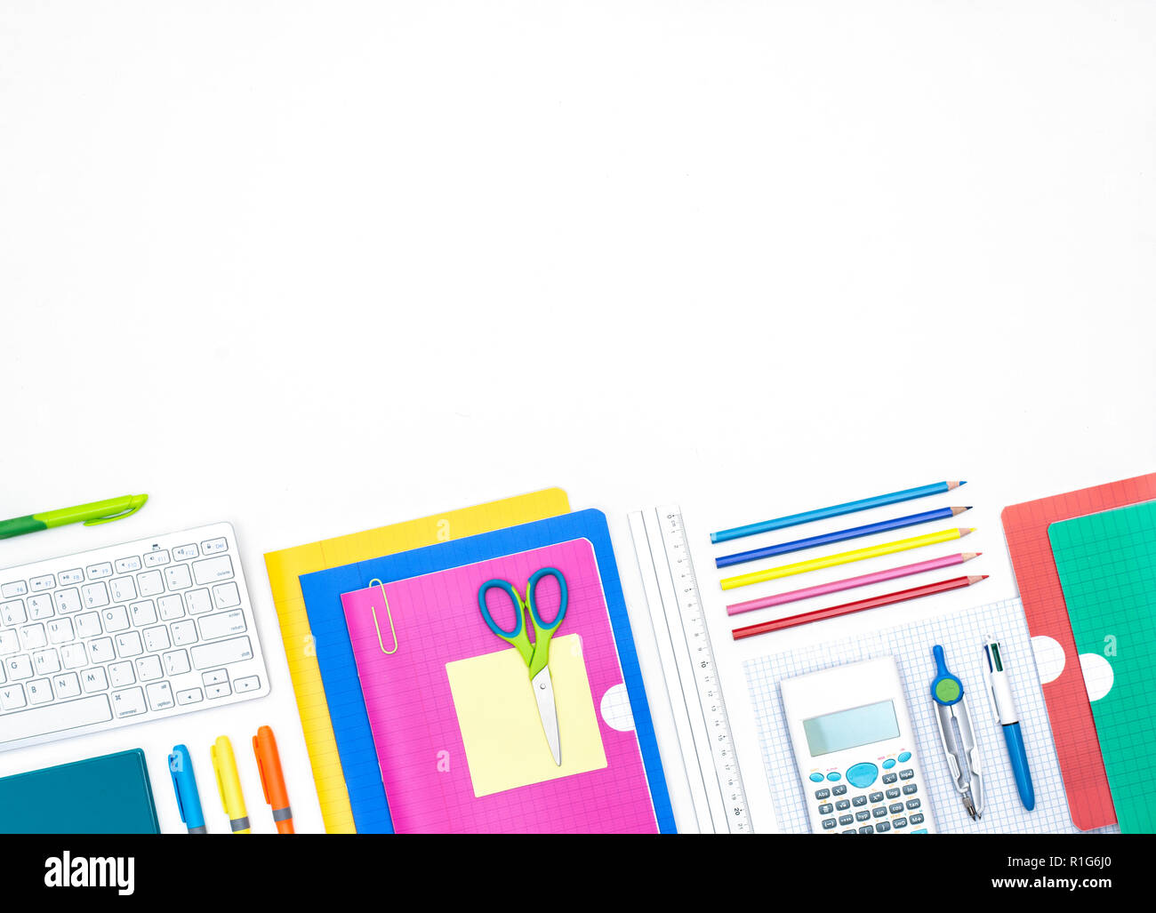 Back to school background header on white. Colorful school items. Stock Photo