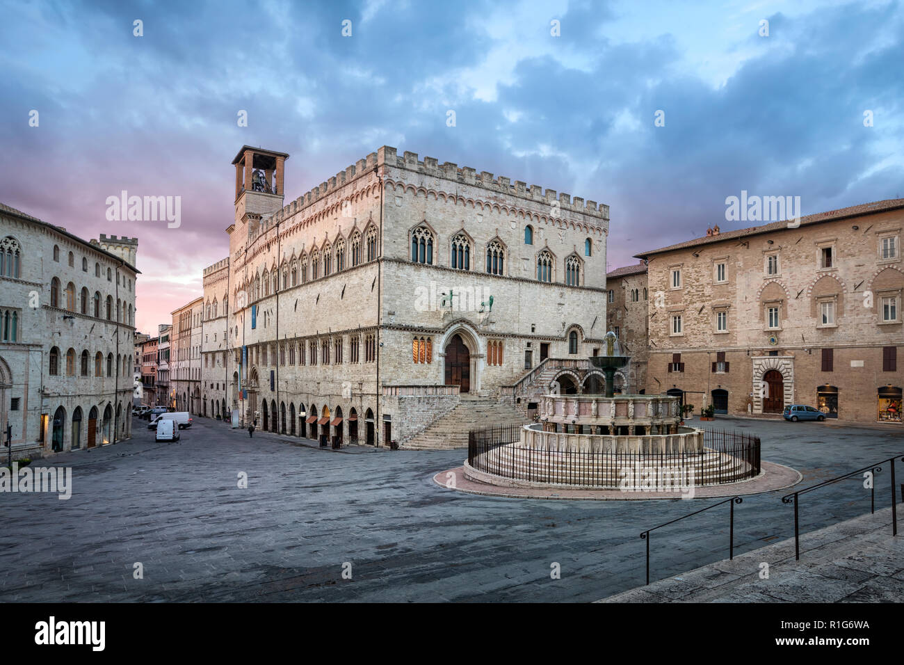 Perugia, Italy. Piazza IV Novembre on sunrise with Old Town Hall and monumental fountain Fontana Maggiore Stock Photo