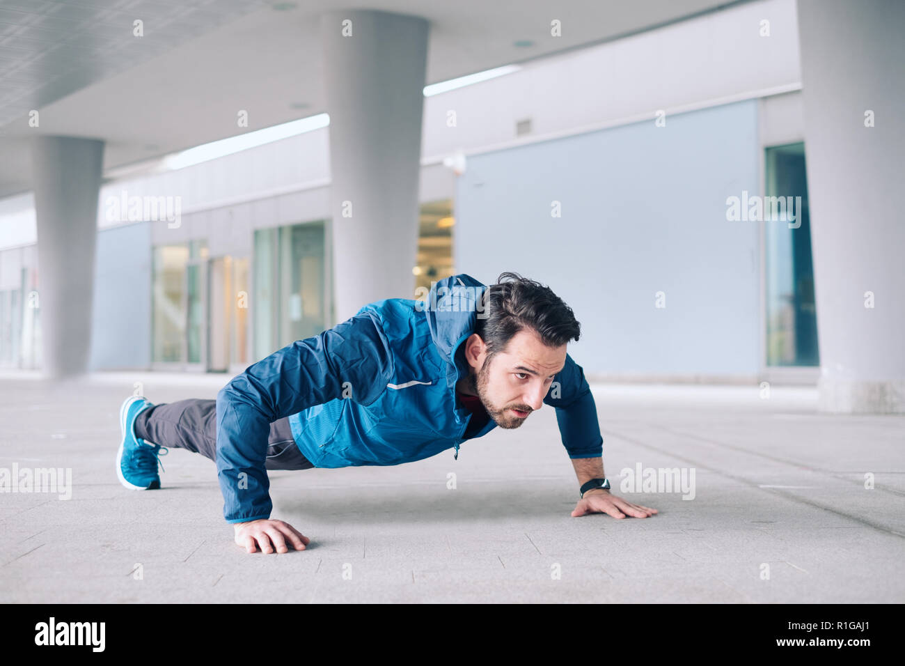 One athlete training with push-up repetitions exercise Stock Photo