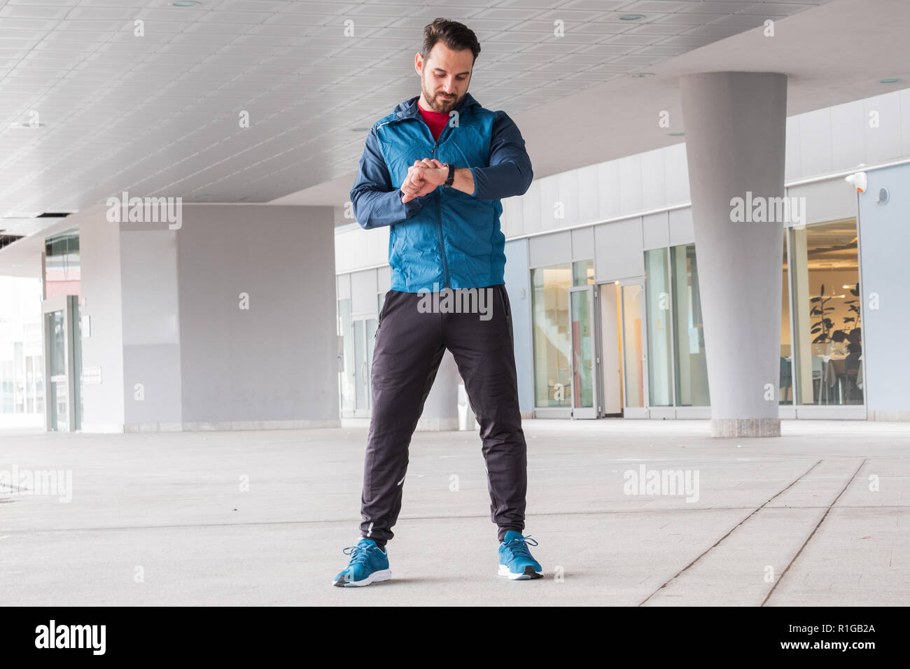 Active man portrait using smartwatch fitness app Stock Photo