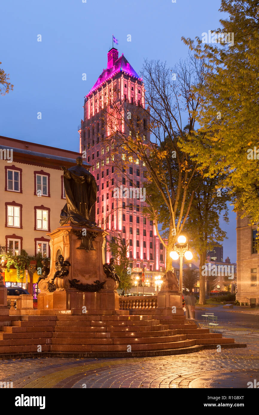 Édifice Price (The Price Building) and Monument Cardinal-Taschereau at Place de l'Hôtel de Ville at dusk in Old Québec City, Québec, Canada. Stock Photo