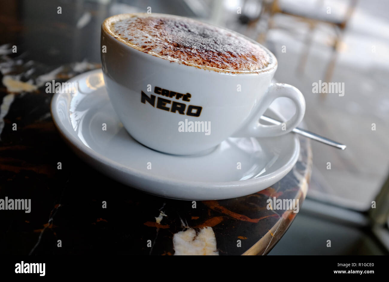 caffe nero cappuccino coffee in white cup and saucer Stock Photo