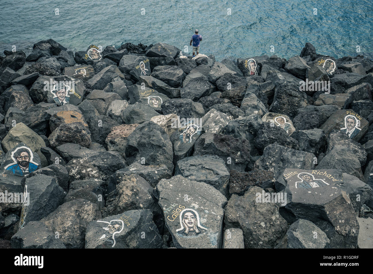 TENERIFE, SPAIN – May 30, 2018: Rocks with painting portraits of famous musicians near Auditorio de Tenerife. Stock Photo