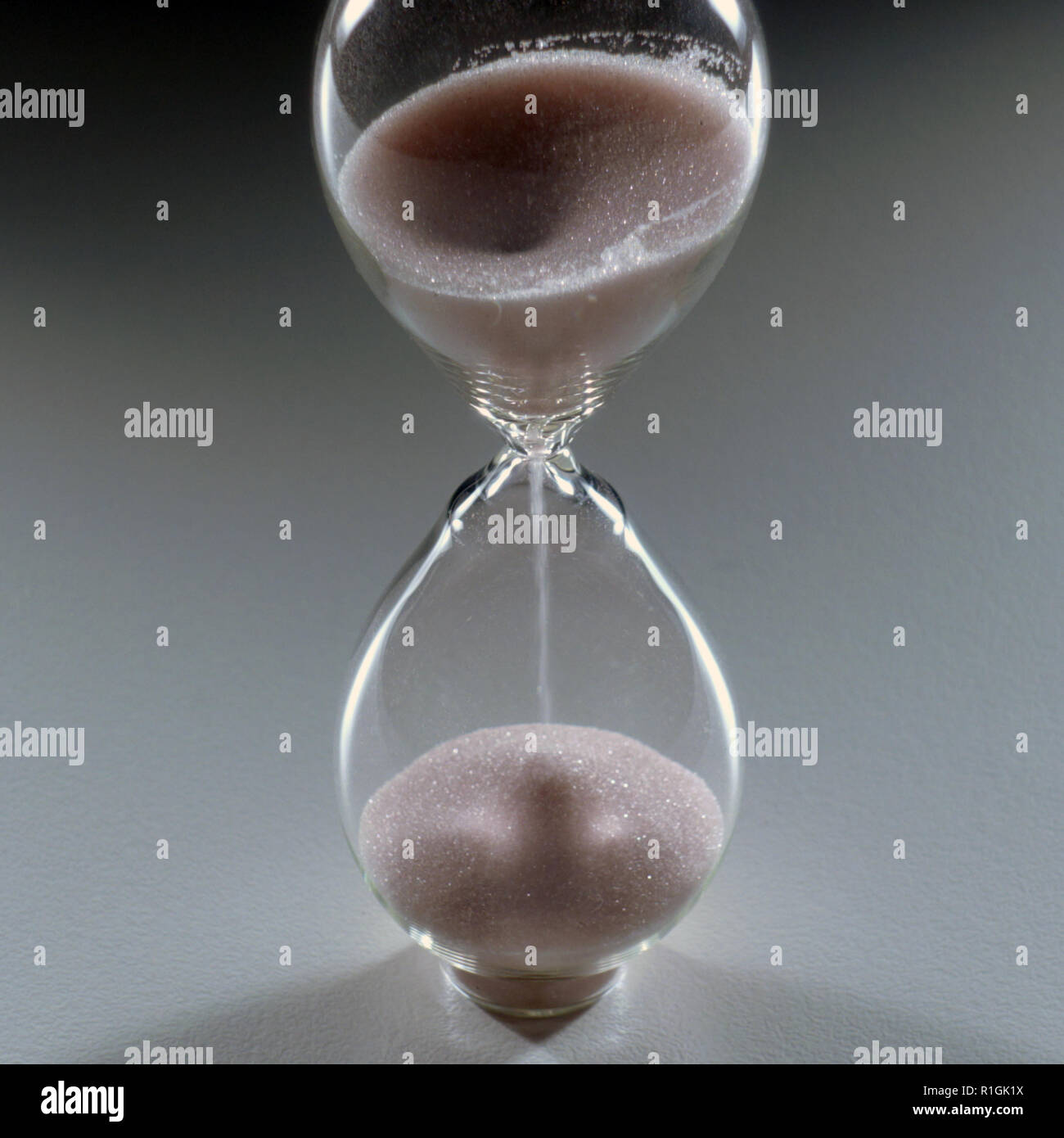 Photo of a isolated hourglass an ancient clock, an instrument for