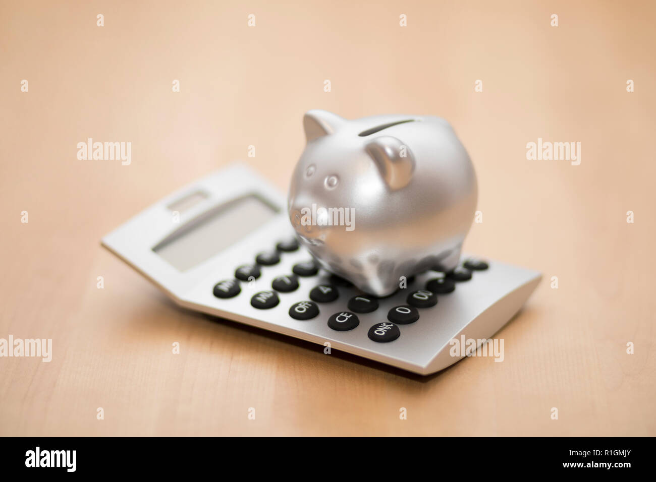 Piggy bank on calculator. Saving, accounting or banking concept. Stock Photo
