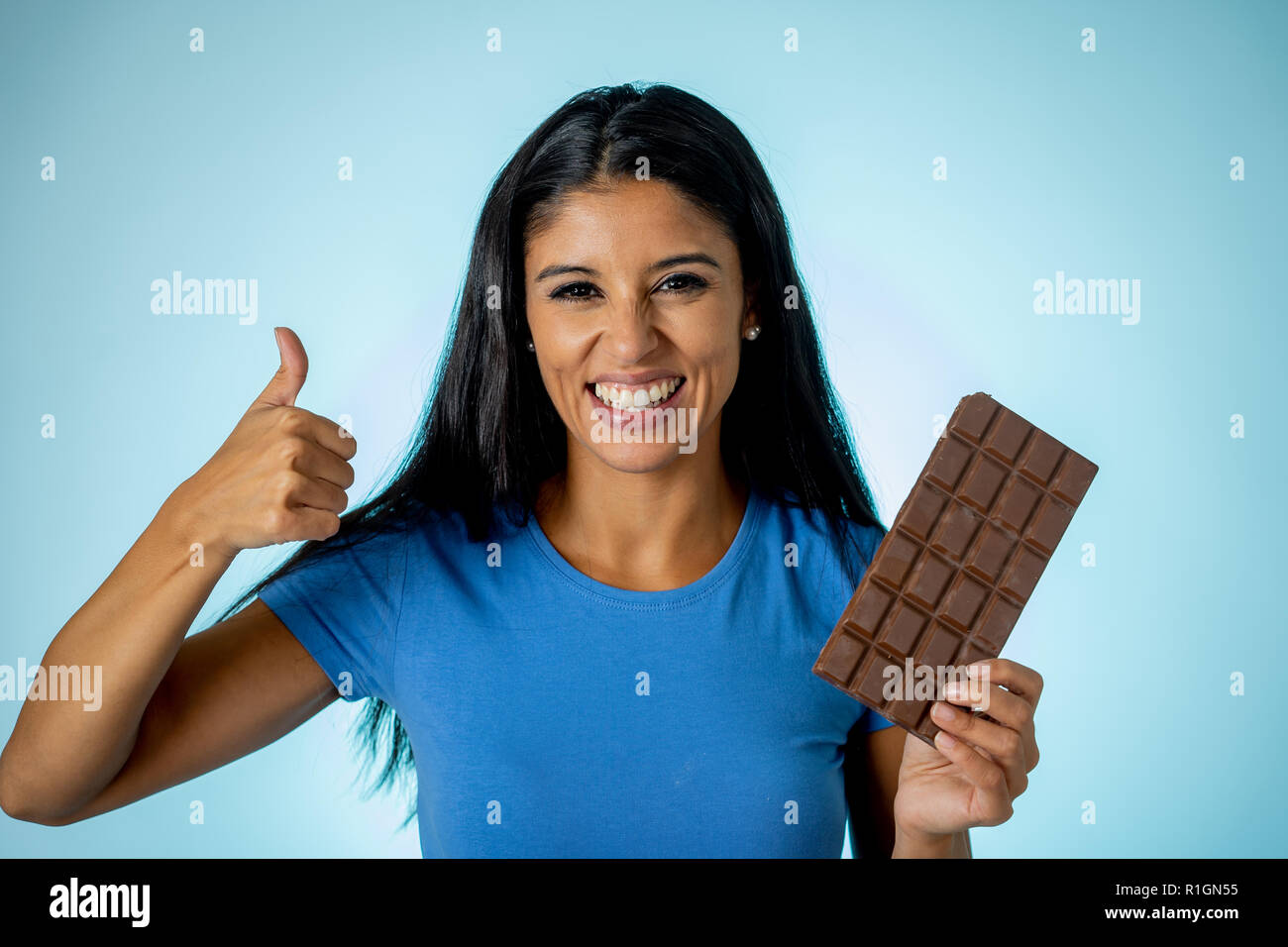 close up shot of voluptuous woman with large breast holding a bar of  chocolate in a bra Stock Photo - Alamy