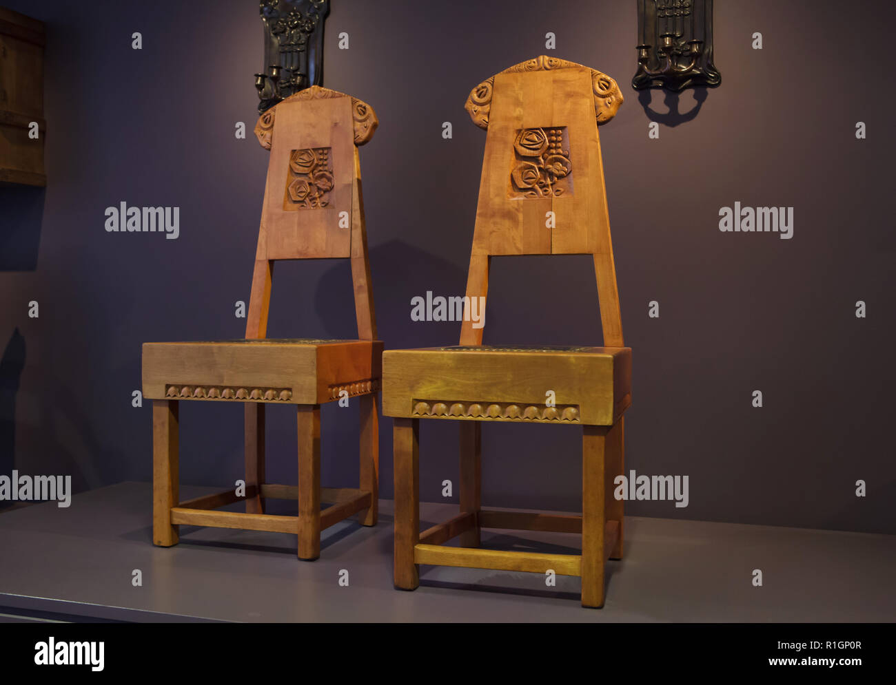 Wooden chairs designed by Russian artist Sergey Malyutin in the Talashkino Workshop (ca. 1900) on display in the Musée d'Orsay in Paris, France. Stock Photo