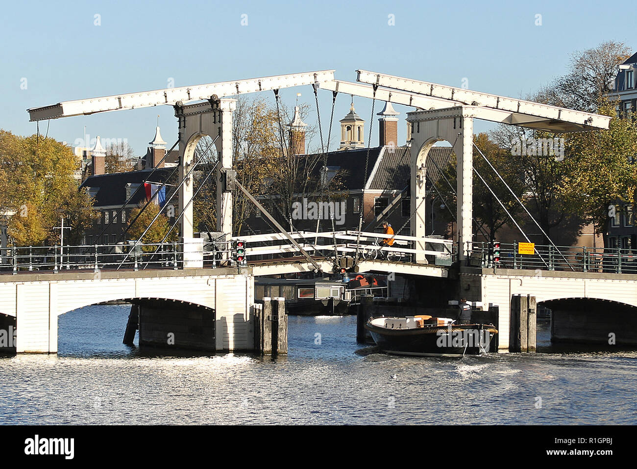 The Magere Brug (English: Skinny Bridge) is a bridge over the river Amstel in Amsterdam, Netherlands. It connects the banks of the river at Kerkstraat, between the Keizersgracht and Prinsengracht. Stock Photo