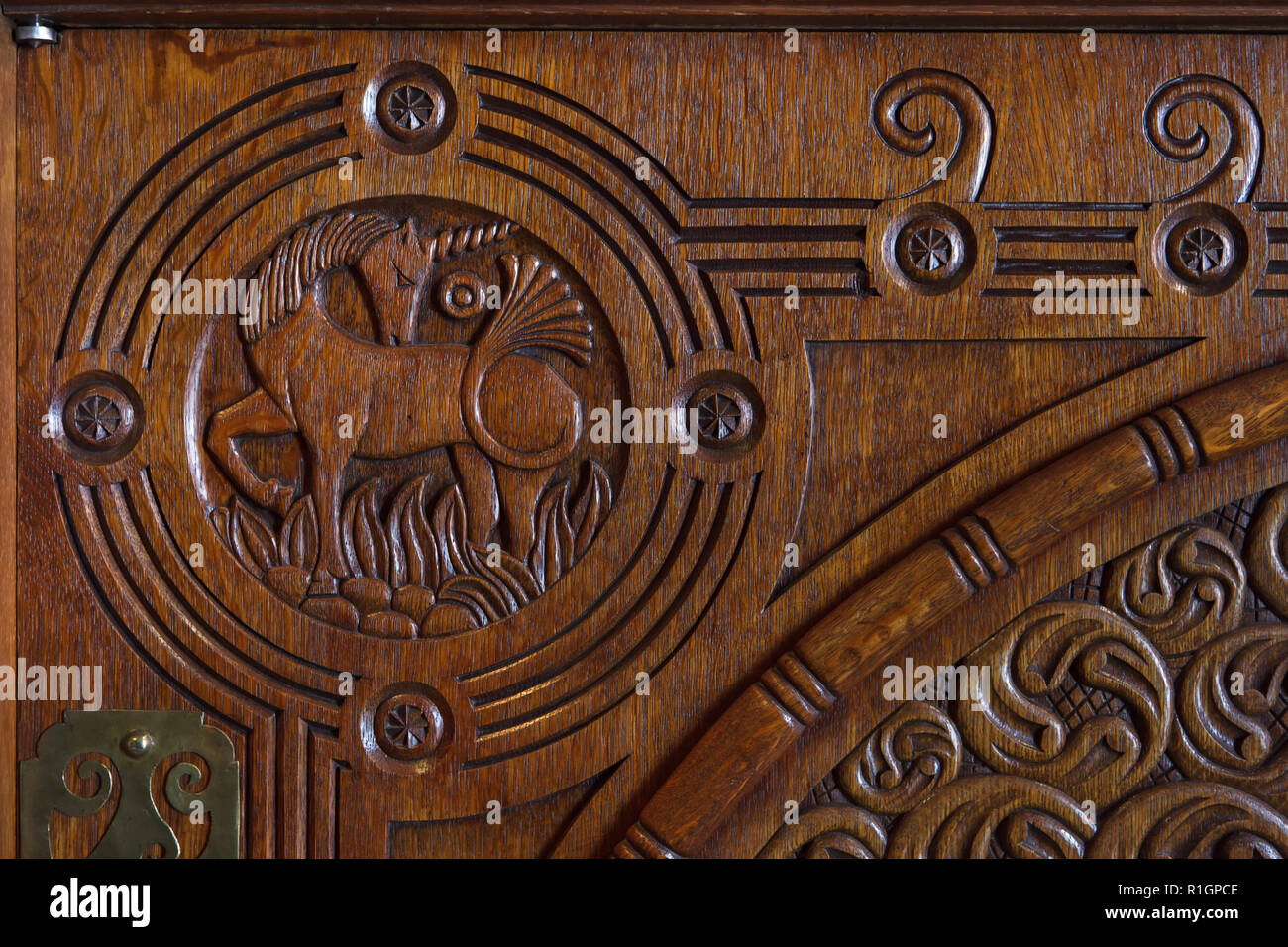 Unicorn depicted in the wooden carved buffet designed by Russian artist Dmitry Sukhov (1903) on display in the Musée d'Orsay in Paris, France. Stock Photo