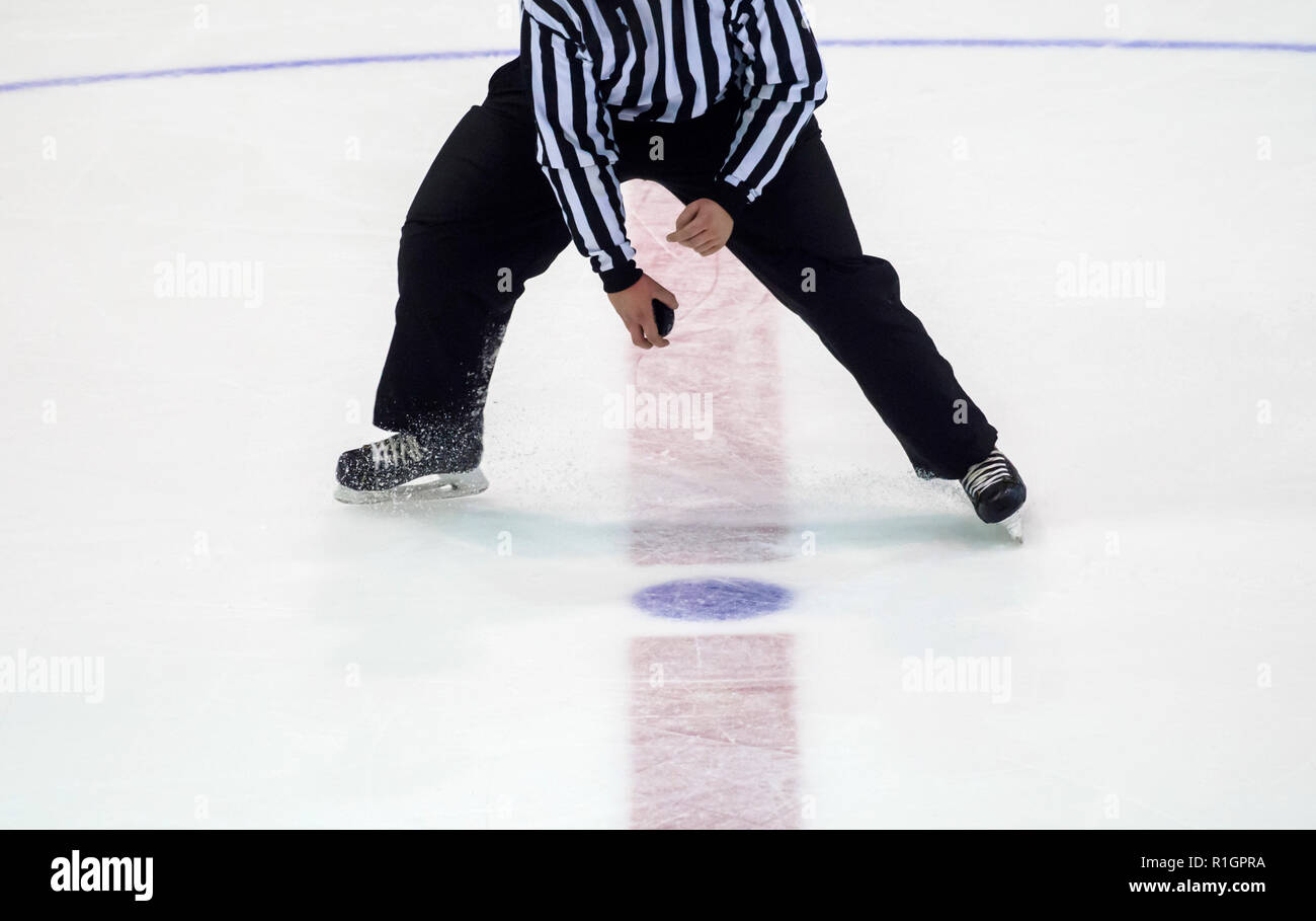 Ice Hockey referee a puck in your hand Stock Photo Alamy
