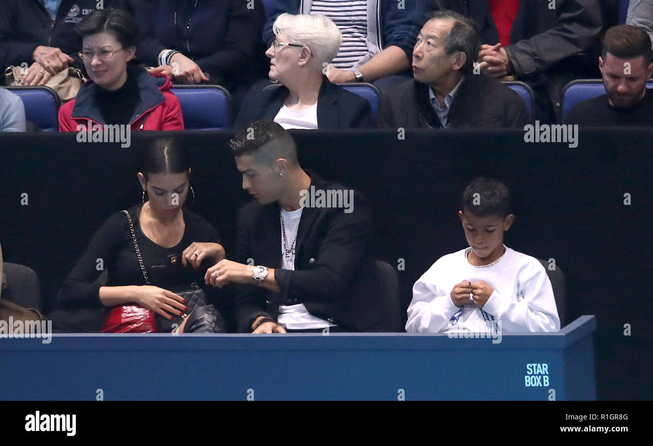 Cristiano Ronaldo (centre) with girlfriend Georgina Rodriguez and son Cristiano Ronaldo Junior in the stands during day two of the Nitto ATP Finals at The O2 Arena, London. PRESS ASSOCIATION Photo. Picture date: Monday November 12, 2018. See PA story TENNIS London. Photo credit should read: Adam Davy/PA Wire. . Stock Photo