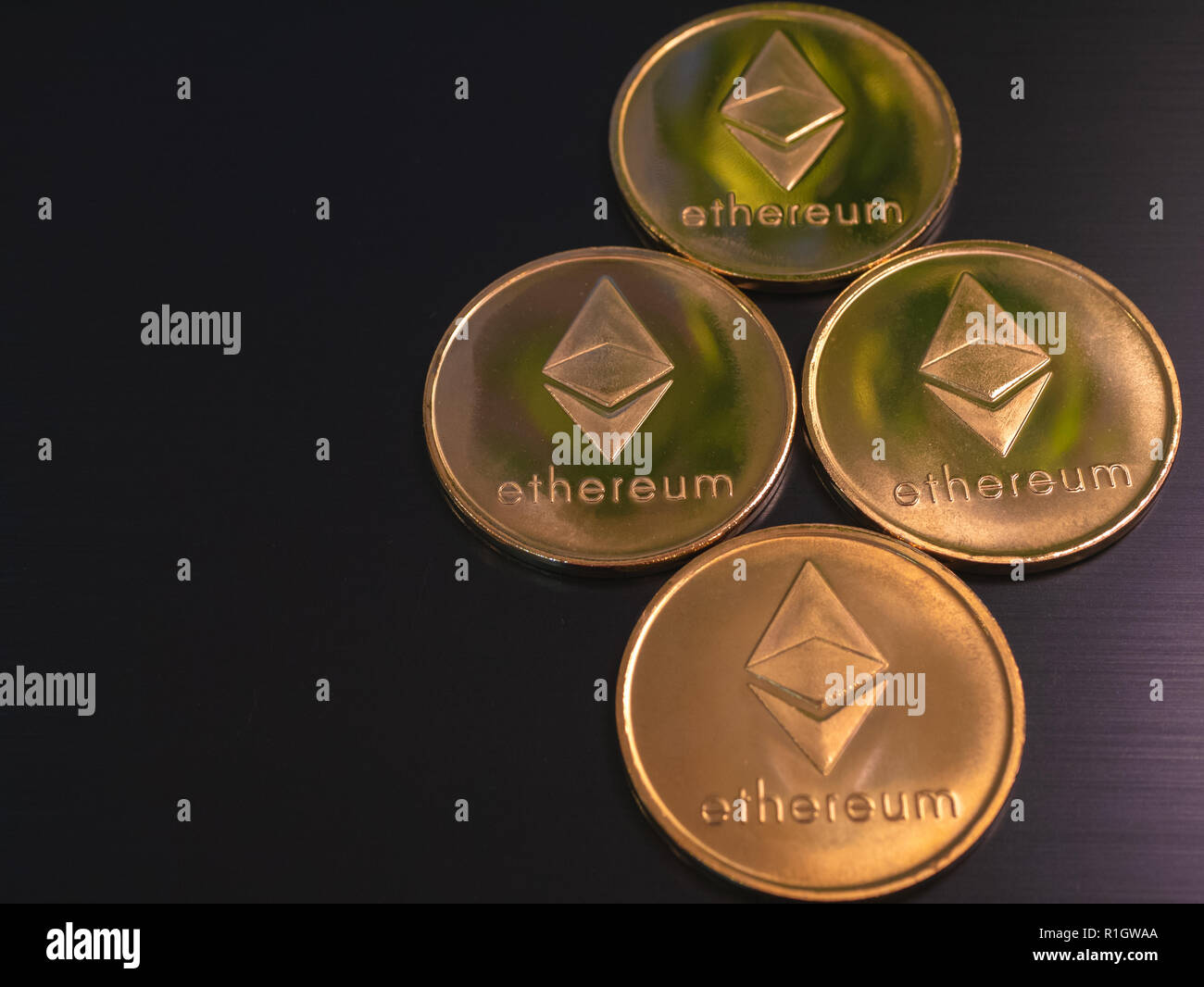 rhombus gold diamond made of ethereum coins. low angle, low key shot on  black background Stock Photo - Alamy