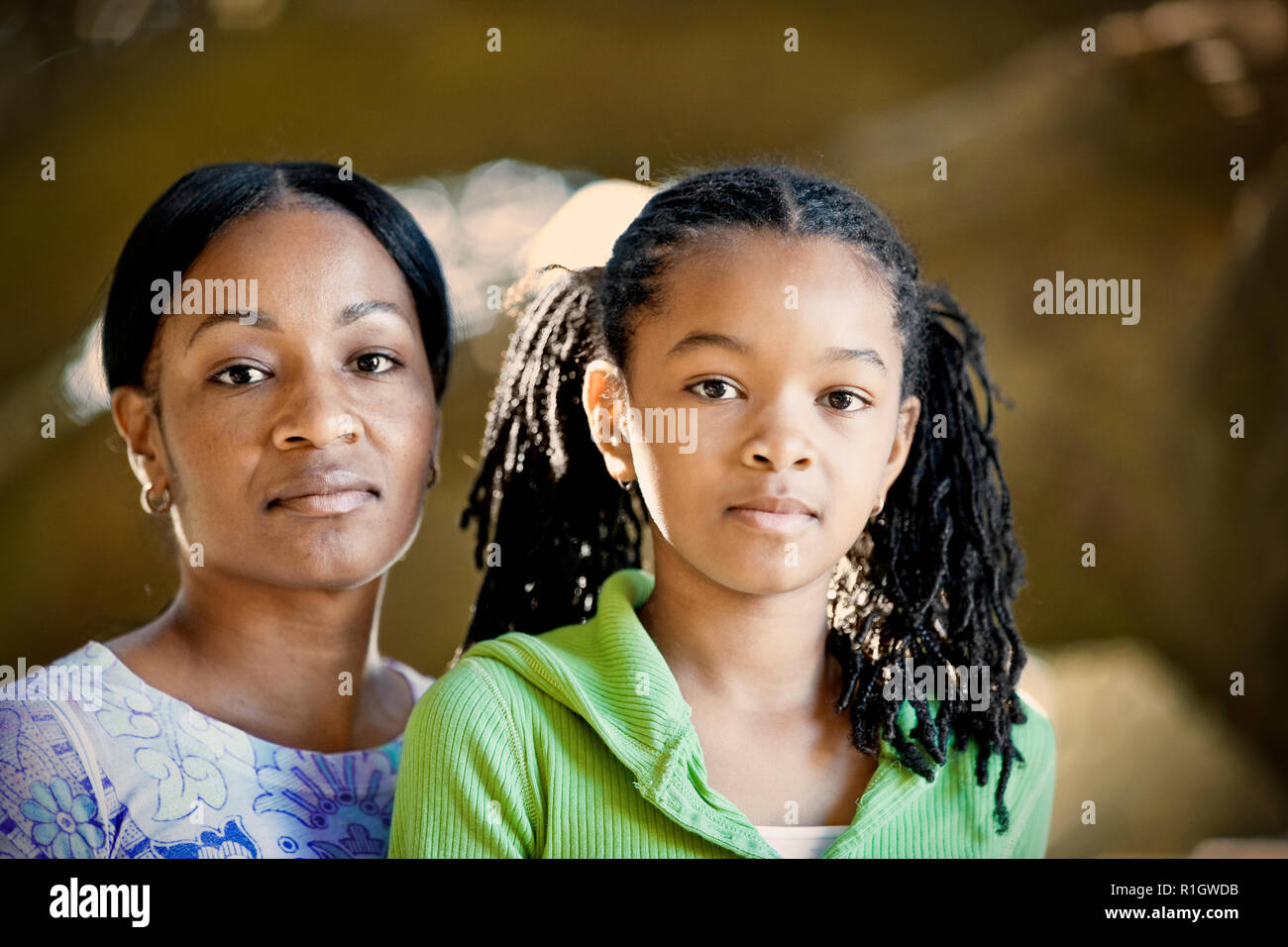 Portrait of a girl with her mid-adult mother. Stock Photo