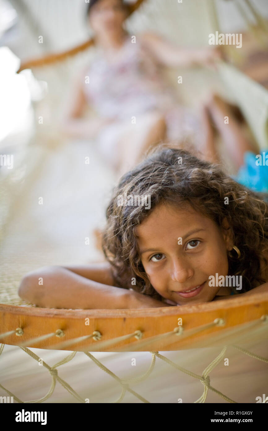 Portrait of a young girl lying in a hammock Stock Photo - Alamy