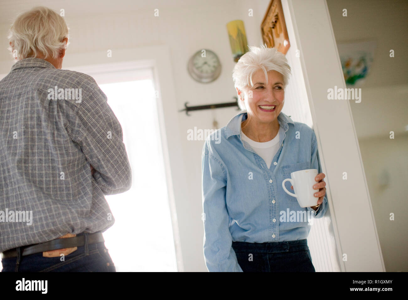Senior couple inside their home Stock Photo - Alamy