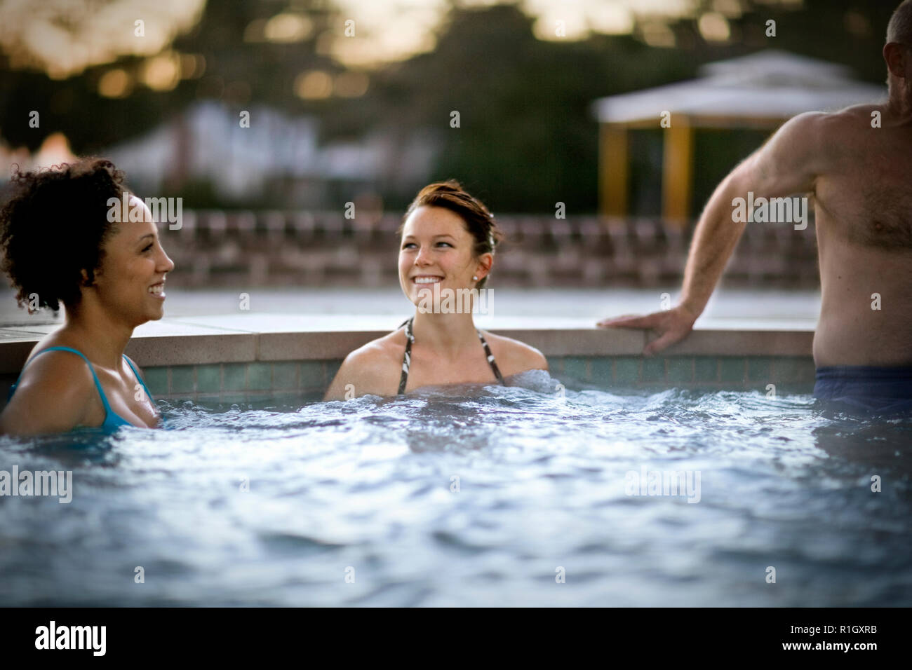 Middle Friends Pool Friends in a swimming pool Stock Photo - Alamy