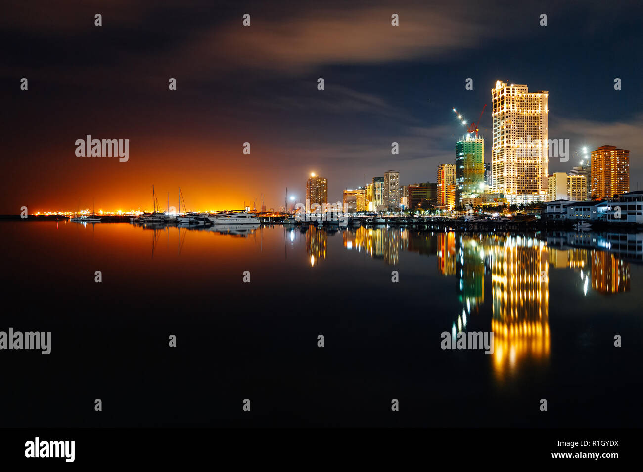 Night skyline of Manila City and Manila Bay, Philippines Stock Photo